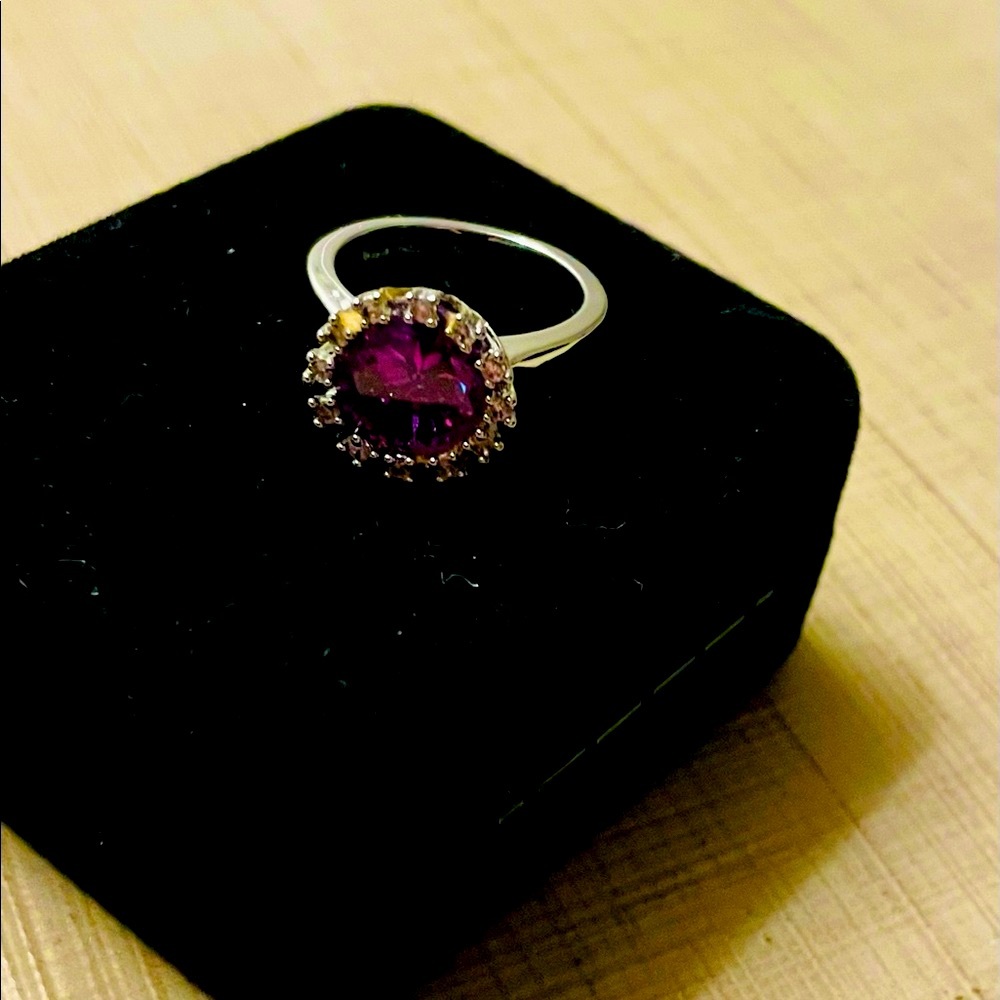 Lady’s ring; faux amethyst and crystals.